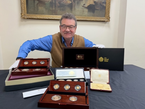 Auctioneer Richard Winterton with some of the collection.